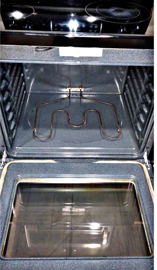 The same oven interior spotless after cleaning