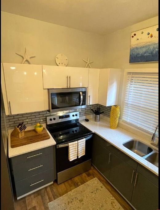 A bright white kitchen with subway tile after a vacation rental turnover