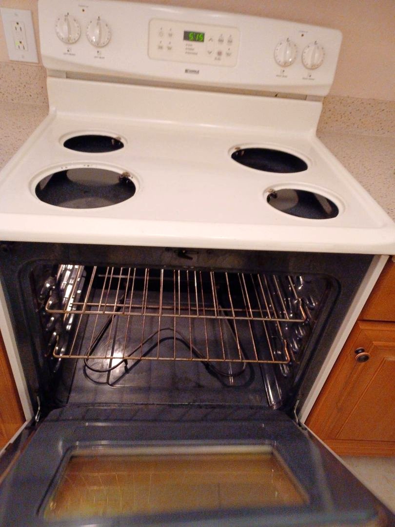 An open oven after a detailed interior cleaning